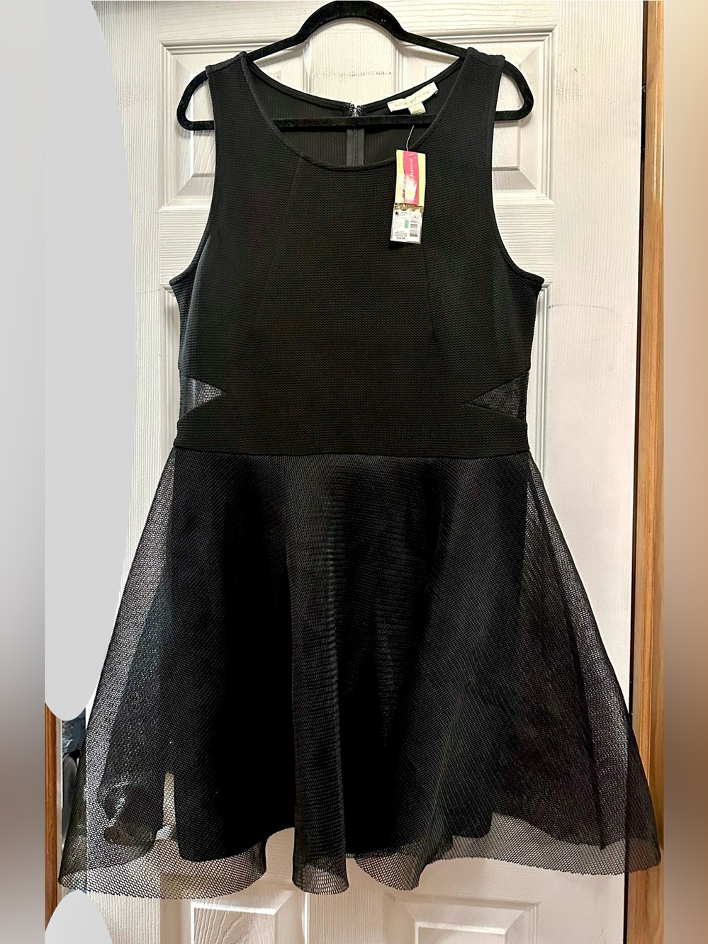 Nicki Minaj Cutout Stretchy.
Party Dress, a textured black fit-and-flare skater